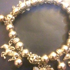 Its a nice silver bracelet with Derby horse charms